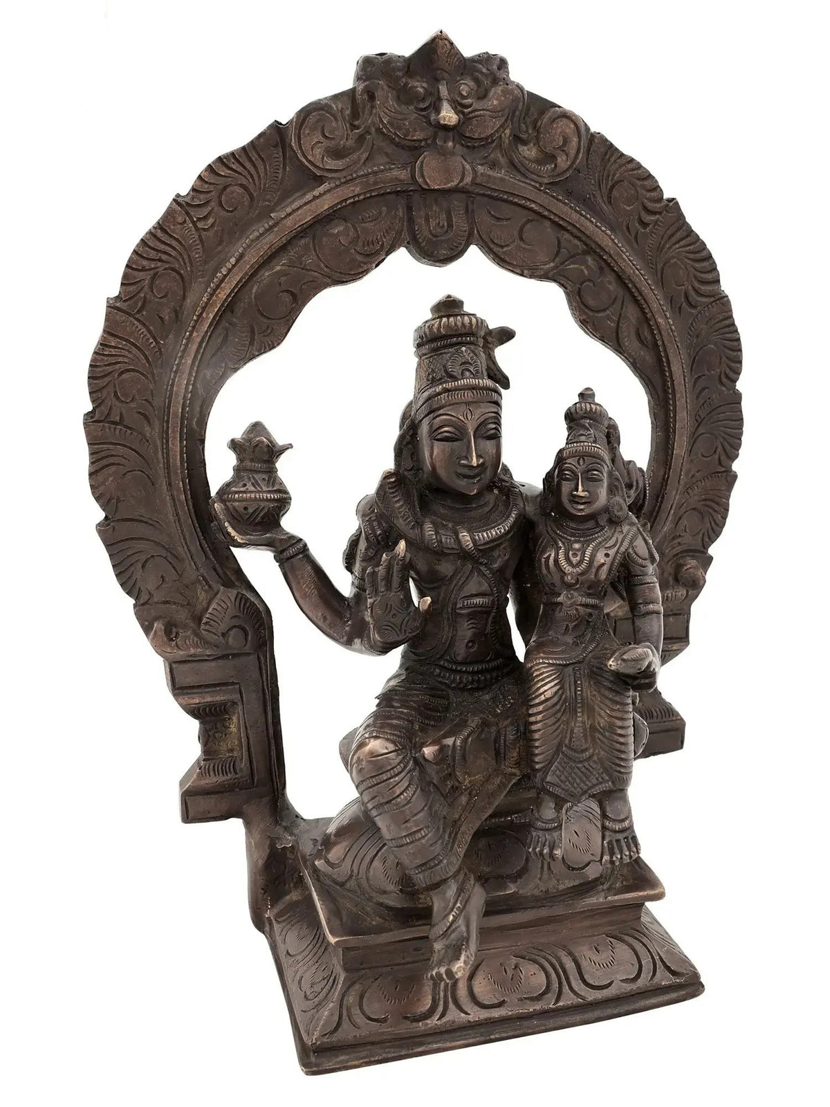 Antique brass Shiva and Parvati idol seated on ornate throne with arch detailing