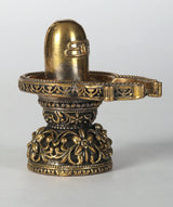 Brass Shiva linga idol with detailed beaded rim and floral carvings, 2 inches