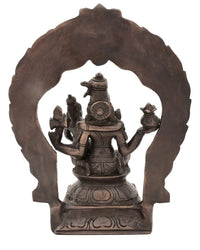 Antique brass Shiva-Parvati idol view from behind on carved arch base throne
