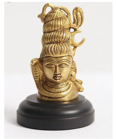 Small brass Shiva head idol with coiled hair and face, mounted on dark round base
