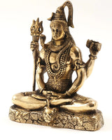 Brass Lord Shiva statue seated in dhyana mudra, hands raised with trident, damaru