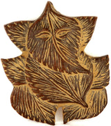Brass Ganesha wall hanging statue with pipal leaf motif, detailed face and lines