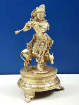 AONA brass Venugopala statue: Krishna holding flute beside cow on pedestal, 10 in