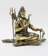 Lord Shiva brass statue, seated with folded hands, trident and ornate bead garlands
