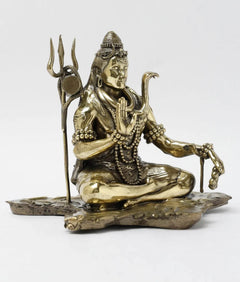 Lord Shiva brass statue, seated with folded hands, trident and ornate bead garlands