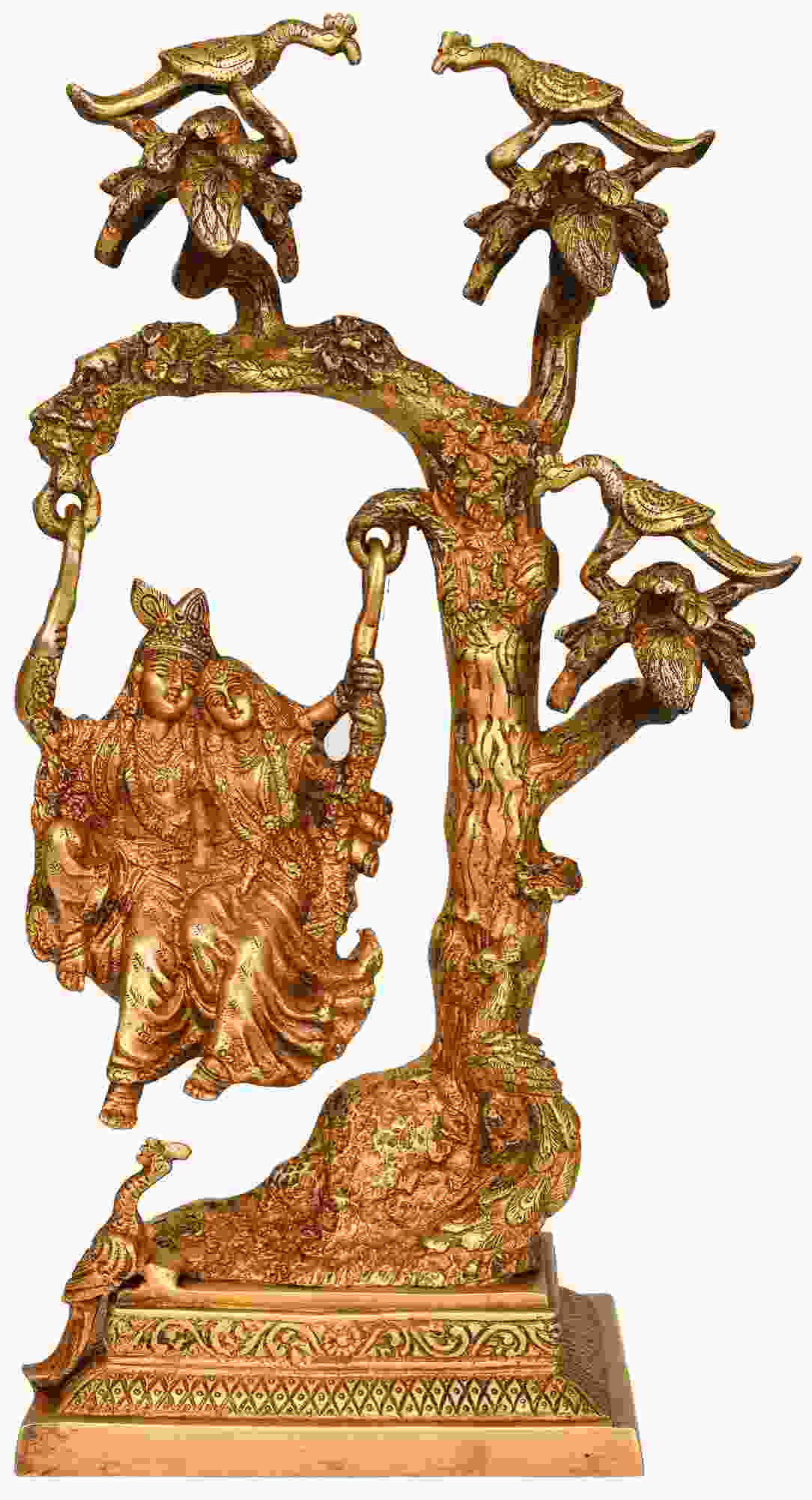Brass Radha-Krishna statue on swing atop ornate tree base, 16 inches