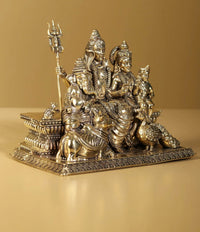 Brass Lord Shiva family statue, four figures seated with ornate headdresses and trident