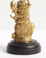 Small brass Shiva head idol, rear-side with stylized headdress, on dark round pedestal base