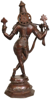 Brass Krishna statue from back view, chariot wheel on chest, dancing pose