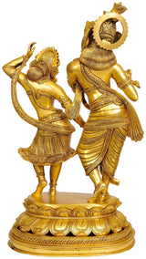 Gold-tone brass Radha-Krishna dancing sculpture, facing figures with detailed ornaments