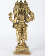 Brass Trimurti idol, rear angle with three heads and draped lower garment