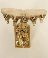 Brass Nandi figurine underside view with Sheshnag heads and engraved torso