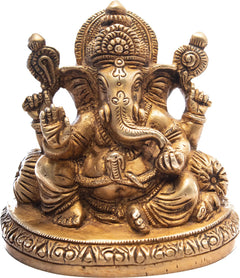 Ganesh brass idol seated with ornate hands and haloed head, circular base