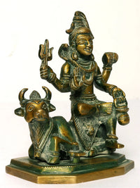 Brass Lord Shiva statue on Nandi, seated posture, detailed jewelry and raised arms