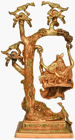 Handmade brass Radha-Krishna swing statue with raised tree and decorative birds, 16 in