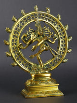 Greenish-gold brass Shiva Nataraja idol with circular ornate halo and dancing arms