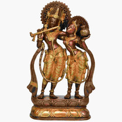 Handcrafted brass Radha-Krishna statue holding flute, ornate pedestal base