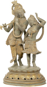 Antique brass Radha-Krishna dance sculpture with two figures holding garlands