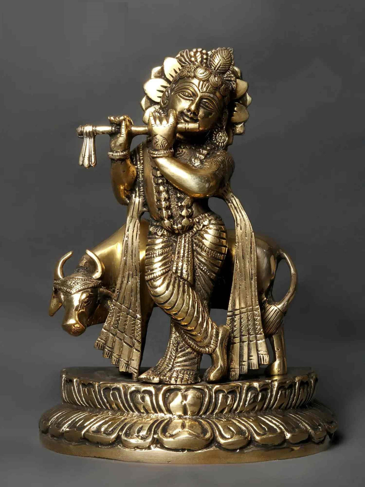 Brass Kanhaiya idol (9 in), flute-playing figure with cows on pedestal