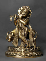 Brass Kanhaiya idol (9 in), flute-playing figure with cows on pedestal
