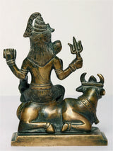 Brass Lord Shiva statue on Nandi, side view showing Nandi horns and Shiva arms