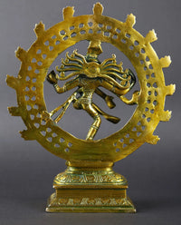 Greenish-gold brass Nataraja idol, side view, ornate circular halo on base