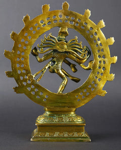 Greenish-gold brass Nataraja idol, side view, ornate circular halo on base