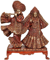 17-inch brass Radha-Krishna statue in ornate red patina, dancing poses