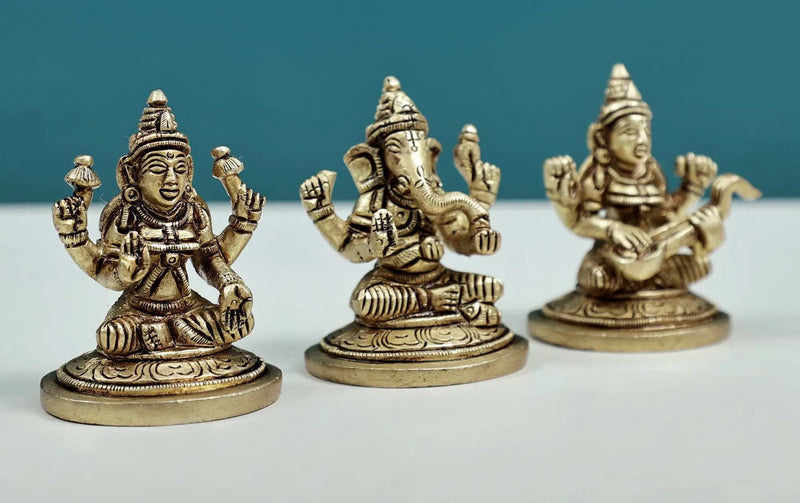 Set of three small brass statues of Ganesha, Lakshmi, and Saraswati 2 inches