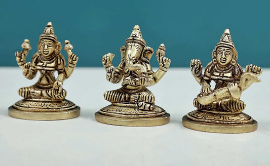 Set of three small brass statues of Ganesha, Lakshmi, and Saraswati 2 inches