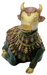 Handmade brass Nandi statue head close-up with decorative horns, jewelry collar