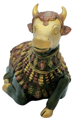 Handmade brass Nandi statue head close-up with decorative horns, jewelry collar