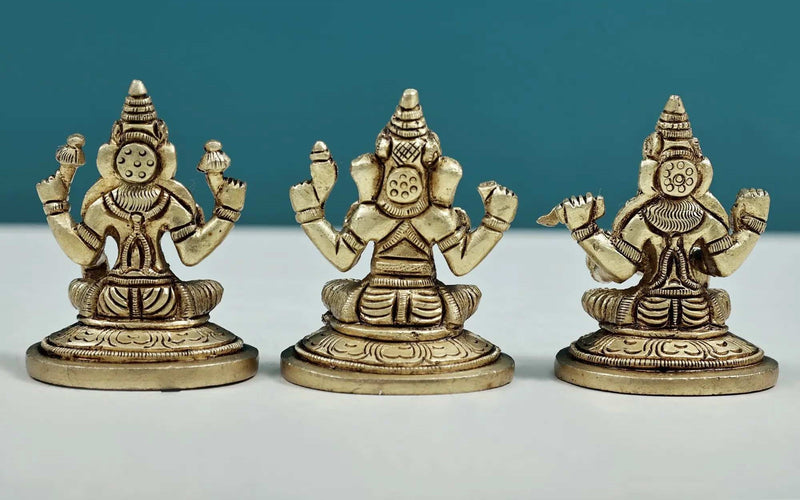 Set of three small brass statues of Ganesha, Lakshmi, and Saraswati 2 inches