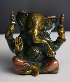 Brass Lord Ganpati Maharaj statue, 3-inch, seated with raised hands and ornate detailing