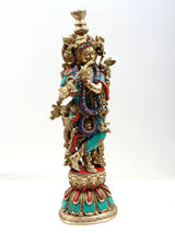 Brass Krishna flute statue with ornate crown and colorful bead inlay, full height