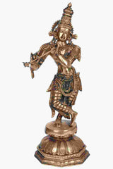 Brass Lord Krishna statue playing the flute, ornate jewelry, standing on pedestal