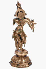 Brass Krishna statue playing flute, side view with engraved pedestal and arm ornaments