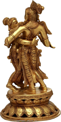 Brass Radha-Krishna dancing idol, side view with ornate legs and pedestal base