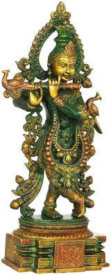 Venugopala Krishna sculpture with flute and ornate jewelry, green with gold details