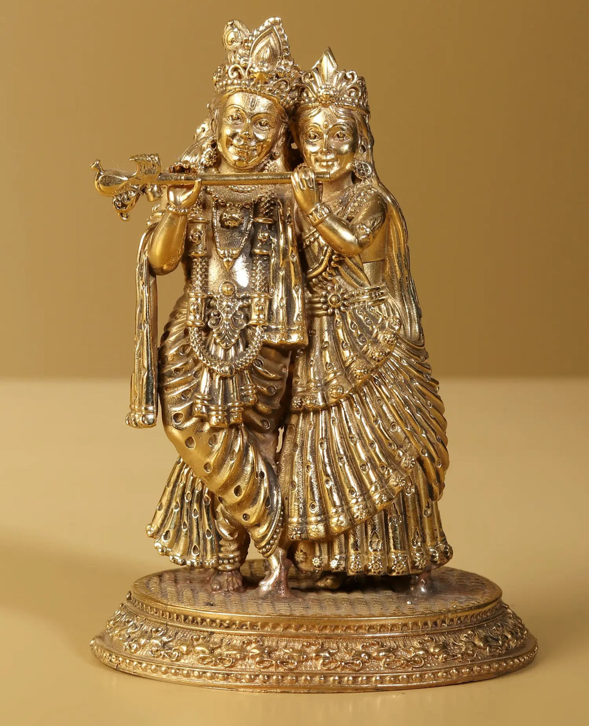 Gold brass Radha Krishna statue with flute, ornate crowns and jewelry, 5 inch