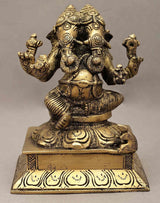 Brass two-headed Ganesha statue, seated with four arms, 5 inches