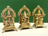 Brass trio statue set with Ganesha, Lakshmi and Saraswati figures, angled view