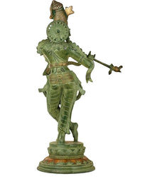 Green-gold brass flutist figurine, side view, flute pointed right, 56 cm
