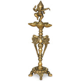 Brass Ganesha lamp, seated figure on tiered stand with wide flame-shaped bowl