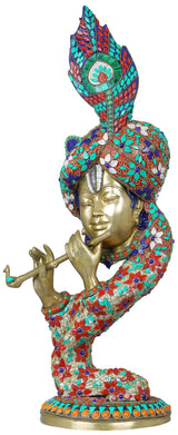 Brass Krishna flute sculpture with turquoise, red, and blue inlay, seated