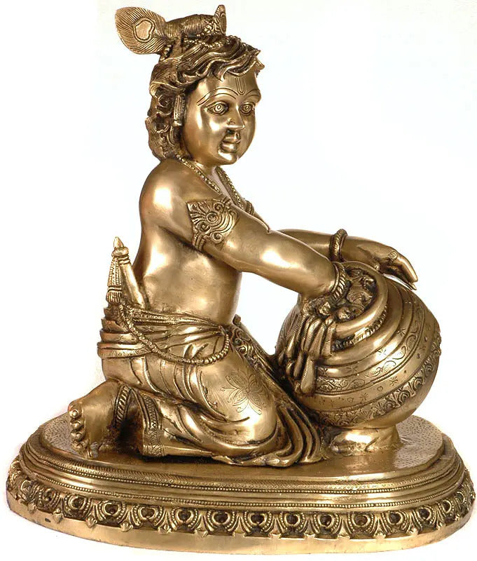 Handmade brass Kanha butter thief statue, seated with hands holding vessel, 18 in
