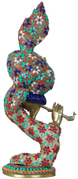 Krishna brass flute sculpture with ornate mosaic robe and raised hand, side view