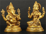 Gold brass pair of Lakshmi and Ganesha statues, side angle, 8 inches