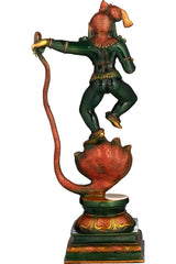 Side view of henna-touch brass Lord Krishna statue with raised arm over serpent tail