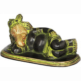 Relaxing Ganesha brass statue lying down, black and gold with green accents